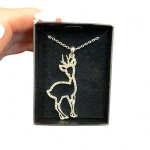 Avon sparkling holiday pendant necklace reindeer silvertone 24” long NIB